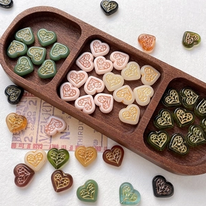 Vintage heart shaped glass beads with gold floral relief for DIY jewelry making