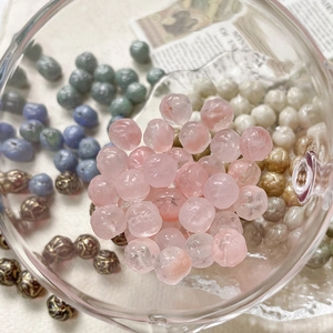 Macro shot of 8mm hand-painted rose glass beads for DIY jewelry making and necklaces