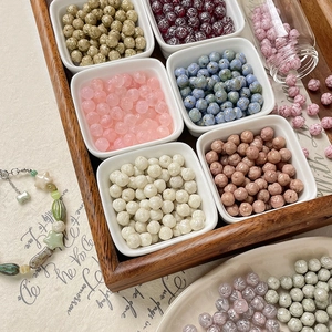 8mm Czech glass rose beads set in wooden tray for DIY handmade jewelry crafting