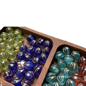 Retro multi-colored Czech glass pumpkin beads with gold-rimmed textures for DIY jewelry