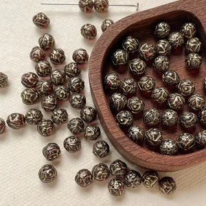 Detailed view of 8mm Czech glass beads with vintage gold rose pattern for DIY jewelry