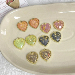 Handmade heart-shaped alloy pendants with gold foil inlay and wavy metallic gold edges