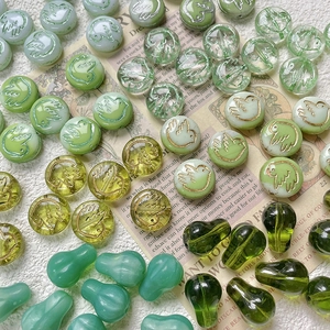 Czech green glass beads with embossed bird patterns for DIY jewelry making and necklaces