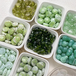 Green Czech glass beads with gold accents and bird patterns for DIY jewelry making