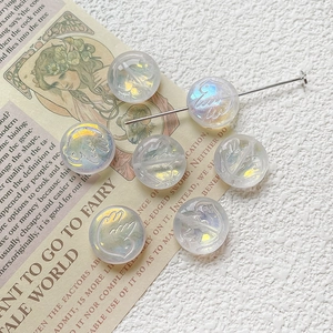 Iridescent green glass beads with bird relief for DIY jewelry making and necklaces