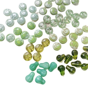 Czech green glass beads with gold-painted bird relief and teardrop pendants for DIY jewelry