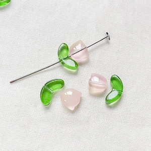 Detailed macro shot of translucent tulip glass beads for DIY jewelry making accessories