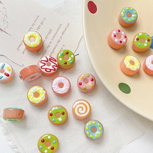 Hand-painted donut glaze glass beads for DIY jewelry making in various pastel colors