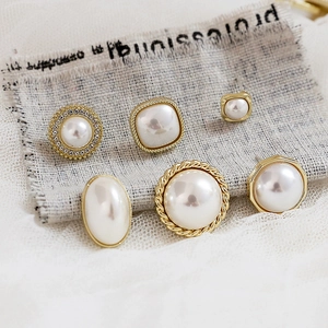 Vintage 925 silver pearl earrings set with geometric gold shapes and rhinestones