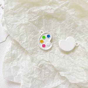 Macro detail of dopamine art palette pendant with colorful enamel for DIY jewelry making
