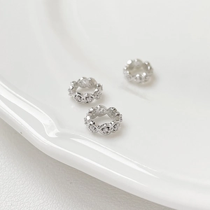 Macro shot of silver plated waist spacers with cubic zirconia for DIY jewelry