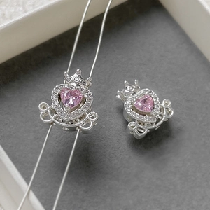 Detail of silver pumpkin carriage beads with pink heart stone and sparkling crystals