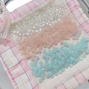 DIY colorful 4mm glass beads for handmade jewelry making on a pastel plaid fabric