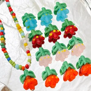 Colorful floral glass beads and handmade beaded necklace with green leaf detail