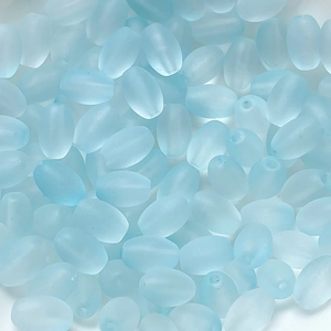 Macro shot of light blue frosted glass rice beads for DIY jewelry making accessories