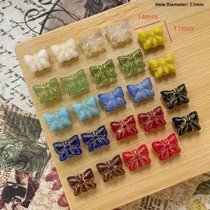 Detail von 14x11mm Vintage Schmetterlingsperlen mit Goldrand für DIY-Schmuck