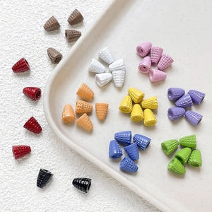 Macro shot of colorful waffle cone beads with LOVE engraving for DIY jewelry