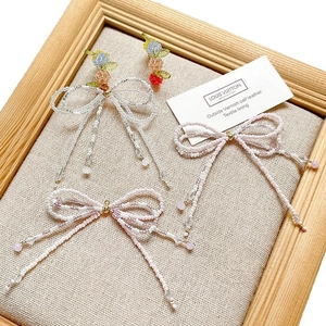 Handmade beaded bow charms with colorful berries and pearls for DIY jewelry making
