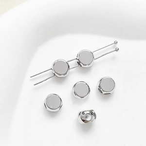 Detailed view of silver-plated copper spacer beads with silicone holes for DIY jewelry