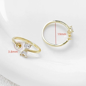 Detail of 18k gold plated bow ring setting with heart zircon for DIY pearl mounting