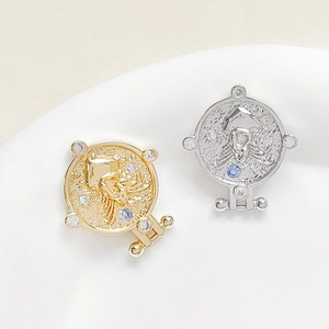 Vintage 18k gold and silver Scorpio coin pendants with colorful zircon inlay