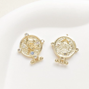 Macro shot of 18k gold plated clock pendant with octopus relief and colorful zircons