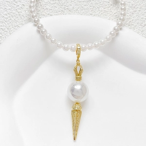 Baroque gold-plated pearl necklace with intricately engraved vajra scepter pendant