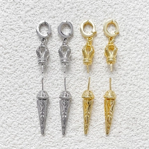 Detailed view of gold and silver plated baroque Vajra pendant connectors for DIY jewelry