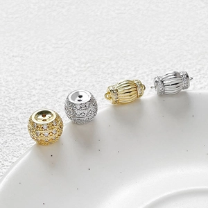 Gold and silver plated zircon screw clasps for DIY jewelry making on white tray