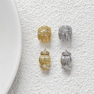 Macro shot of gold and silver plated pave zircon screw clasps for jewelry making