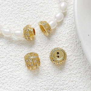 Macro shot of gold-plated screw clasp with micro-set zircon for DIY pearl necklaces