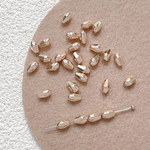 Macro view of rose gold faceted metal beads for DIY jewelry and beaded necklaces