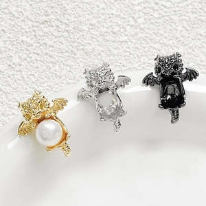Three gold, silver, and black flying dragon pendant charms for DIY jewelry making