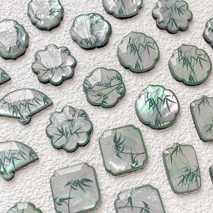 Detail view of pearlescent bamboo resin charms for DIY jewelry and hair accessories