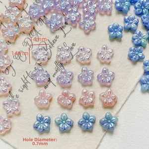 Vue détaillée de perles fleurs 14mm en verre tchèque coloris macaron pour bijoux DIY