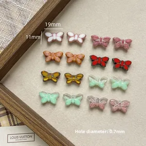 Macro detail of colorful butterfly glass beads measuring 19mm by 11mm for DIY jewelry