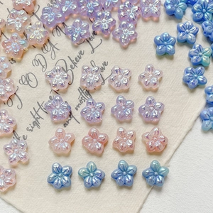 Pearlescent flower beads in pastel gradient colors for DIY jewelry making and crafts