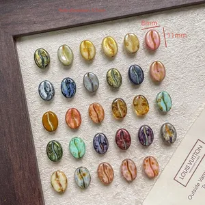 Detail view of 11x8mm coffee bean glass beads for DIY jewelry with hole size details