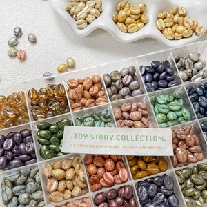 Macro detail of assorted coffee bean glass beads in various colors for DIY jewelry making