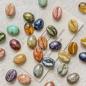 Macro view of coffee bean shaped Czech glass beads for DIY jewelry making and crafts