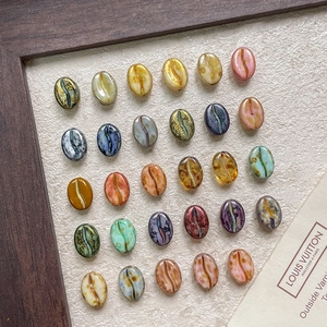Polished coffee bean shaped glass beads with gold accents for DIY jewelry making