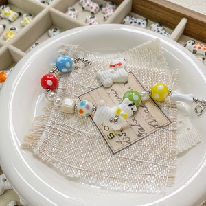Hand-painted ceramic puppy and polka dot bead bracelet with silver lobster clasp