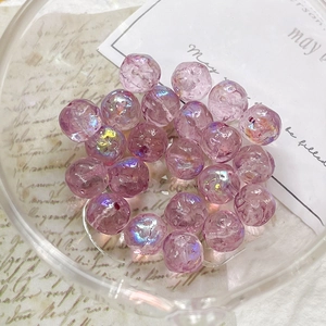 Macro shot of purple iridescent Czech glass beads for DIY jewelry with AB coating