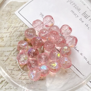 Macro shot of faceted pink iridescent Czech glass beads for DIY jewelry making