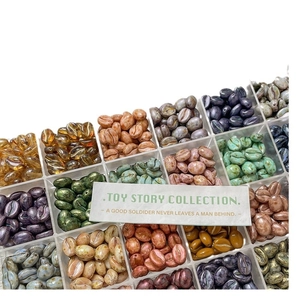 Assorted colorful coffee bean glass beads in a clear storage box for DIY jewelry making