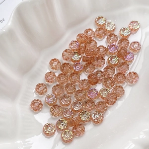 Macro shot of iridescent champagne glass flower beads with AB coating for DIY jewelry