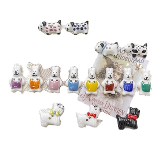 Hand-painted ceramic animal beads featuring colorful rabbits and spotted dogs for DIY jewelry