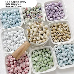 Macro shot of 8mm multi-color ceramic beads with 3.3mm large holes for jewelry making