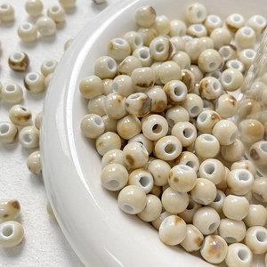 Celadon kiln-glazed ceramic beads in cream white with brown speckles for DIY jewelry