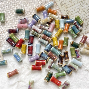 Macro shot of hand-painted bamboo joint ceramic beads for DIY jewelry making